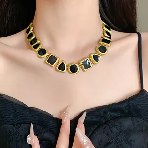 Vintage palace style geometric necklace featuring black enamel and gold plating details