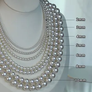 Comparison of pearl bead sizes from 2mm to 10mm on a white jewelry display stand.