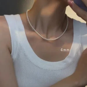 Close-up of 4mm French retro pearl beaded necklace on a elegant female model