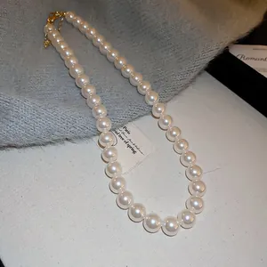 Close-up detail showing the lustrous finish of a French retro white pearl beaded necklace