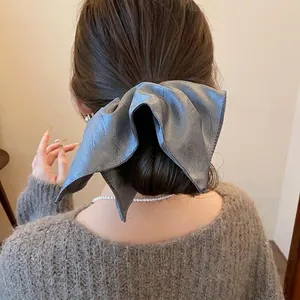 Large blue-grey faux leather scrunchie hair tie accessory for vintage ponytail styles.