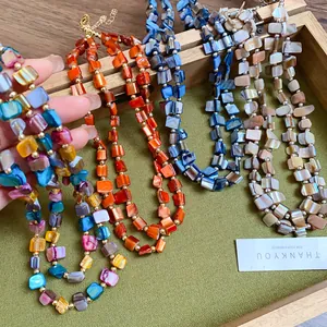 Close-up view of colorful irregular double-layer shell necklaces in bohemian retro style