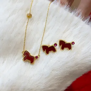 Close-up of red pony jewelry set with necklace and stud earrings