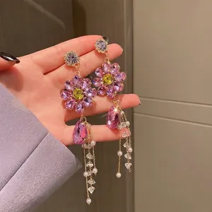 Exaggerated purple flower tassel earrings with crystals for a bold fashion statement
