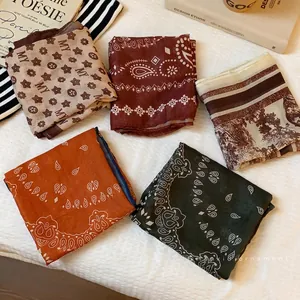 Collection of vintage paisley and floral print square scarves in earthy tones