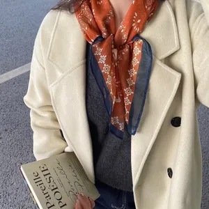 Elegant retro paisley print neck scarf for women paired with a beige autumn coat