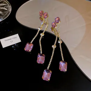 Elegant purple gemstone long tassel drop earrings with sparkling rhinestones macro view