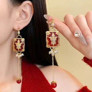 Exquisite vintage red enamel drop earrings with faux pearls and a gold floral star pattern