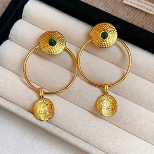 Vintage style gold plated textured hoop earrings with green gemstone accents