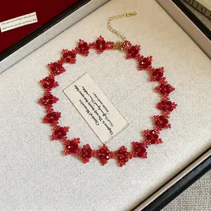 Elegant red flower beaded choker necklace featuring handcrafted floral motifs and gold clasp