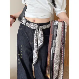 Stylish bohemian paisley print fabric scarf belt for women worn with dark denim jeans