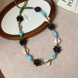 Bohemian style handmade beaded flower waist chain with green cord and turquoise beads
