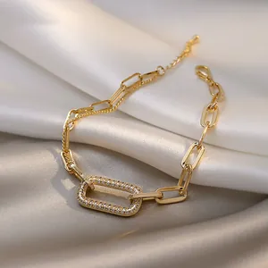 Close-up of vintage geometric gold chain bracelet with pavé rhinestone rectangle detail