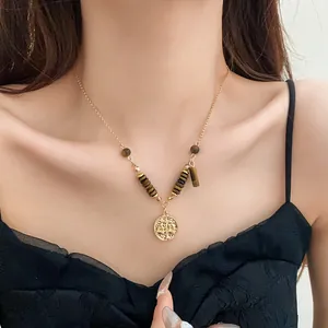 Retro tiger eye stone collarbone necklace for women featuring a circular gold pendant