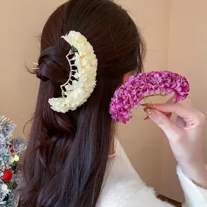 Handmade fabric flower hair pins in cream and purple for elegant hair styling