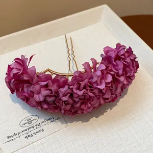 Detailed view of a purple fabric flower hairpin in elegant new Chinese style design.