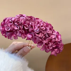 Close-up view of purple fabric flower hairpin with dense petals in new Chinese style