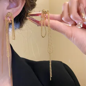 Detailed view of 18k gold plated knotted tassel clip-on earrings showing elegant texture