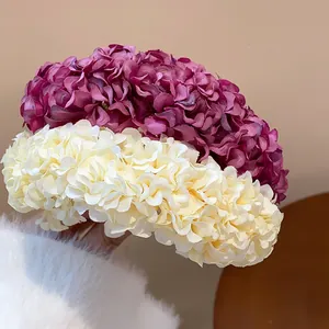 Close-up detail of new Chinese style handmade fabric flower hairpins in purple and cream