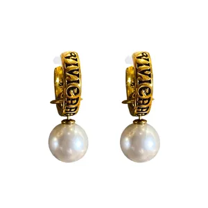 Exquisite vintage gold hoop earrings featuring engraved VIVIENNE text and white pearl drop