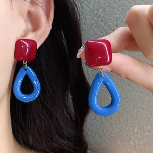 Retro red square and blue oval resin earrings for women with silver needle detail