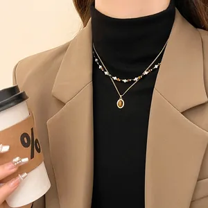 Elegante collana a doppio strato in stile retrò con occhio di tigre e ciondolo dorato