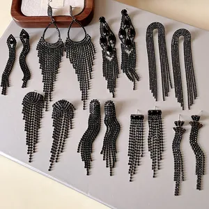 Detailed display of various black rhinestone long tassel earrings in different styles.