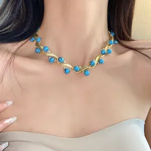 Vintage court style turquoise necklace with gold geometric wavy design and diamonds
