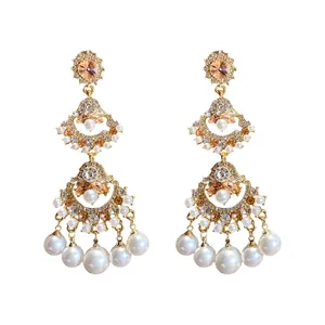 Vintage gold chandelier earrings with champagne crystals and white pearls for women