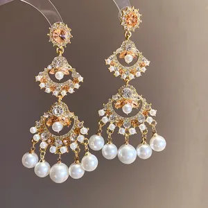 Detailed view of vintage ethnic earrings with pearls and crystals