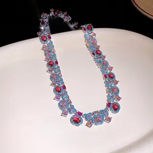 Elegant palace-style necklace featuring pink and red oval zircons with blue accents