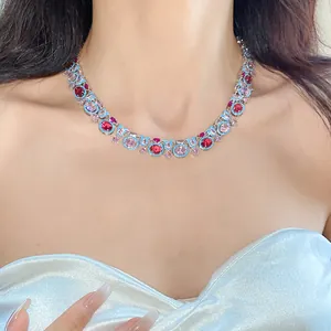 Close-up detail of a luxury vintage choker featuring sparkling red and pink oval zircons