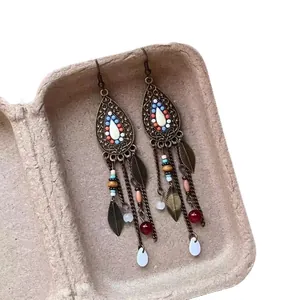 Bohemian ethnic vintage earrings with leaf charms and bead tassels in bronze finish