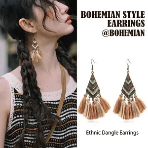 Bohemian style geometric leaf earrings with long cotton tassels and vintage bronze finish details