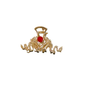 Elegant gold metal dragon hair claw clip with a red bead in Chinese style