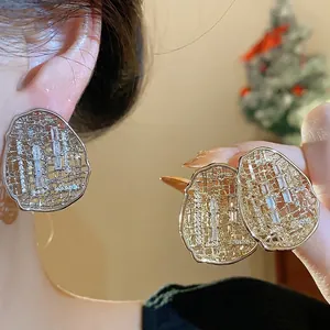 Vintage gold-plated hollow oval zircon stud earrings featuring a mesh pattern for women