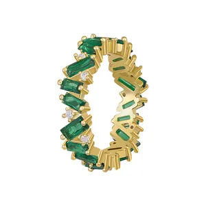 Exquisite gold-plated geometric ring featuring emerald green baguette-cut zircon stones