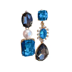 Elegant French vintage style asymmetrical dangle earrings with blue crystals and pearls