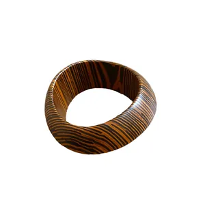Retro wide bangle bracelet with brown and black zebra pattern on white background