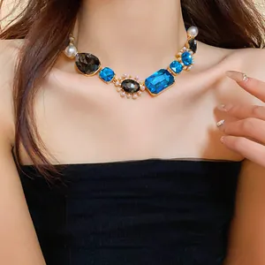 Close-up detail of a French vintage necklace featuring blue and black crystals with pearls