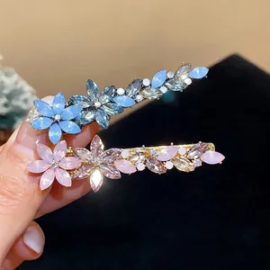 Elegant rhinestone floral duckbill hair clips with blue and pink resin petals for women.
