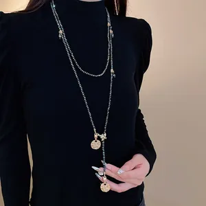 Elegant vintage style long beaded sweater necklace with gold coins and bee charms