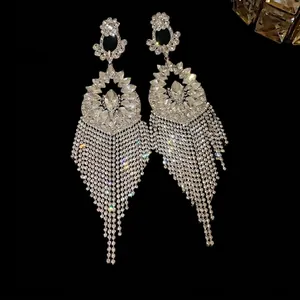 Luxurious silver needle earrings featuring rhinestone flowers and long tassel fringe