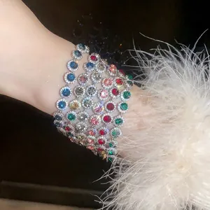 Luxurious multi-colored round cubic zirconia bracelet set on wrist with feather detail