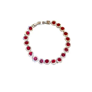 Elegant silver-tone bracelet featuring round red cubic zirconia with crystal halo