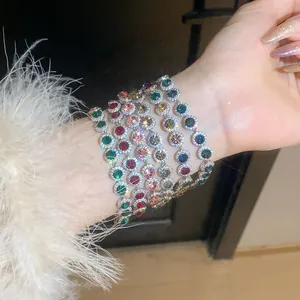 Detailed close-up showing sparkling colorful zircon round pendant bracelets on a female wrist