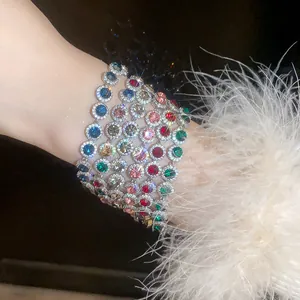 Macro view of exquisite colorful round zircon bracelets with sparkly halo crystals for women