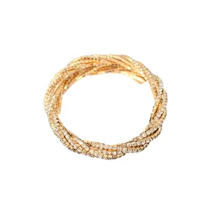 Elegant multi-layer twisted bracelet encrusted with sparkling rhinestones in gold tone