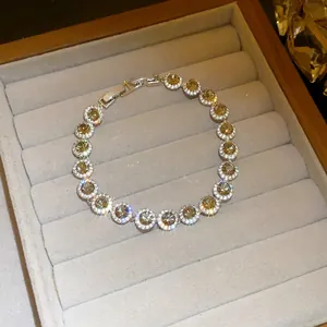 Detailed macro view of a sparkling champagne cubic zirconia round pendant bracelet