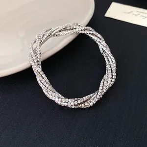 Detailed view of luxury multi-layer silver wrap bracelet with sparkling clear rhinestones